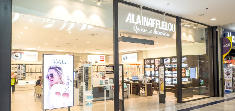 Façade de la boutique Alain Afflelou dans un centre commercial lyonnais.